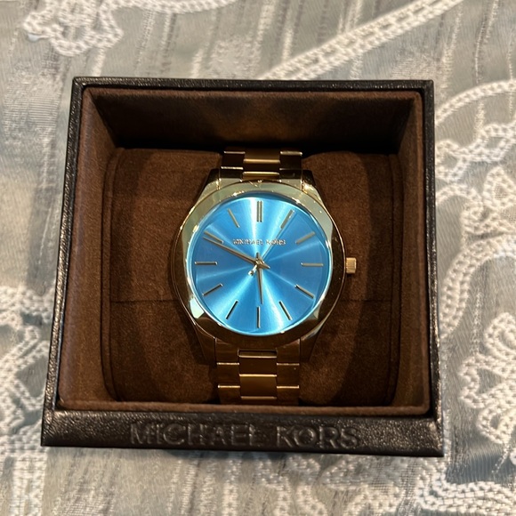 Michael Kors gold watch with blue face. - Picture 6 of 7